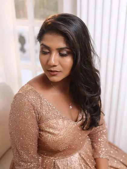 A glamorous look for a pre-wedding shoot, with a shimmering rose gold dress and smokey eyes.