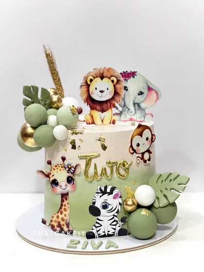 A jungle-themed cake with a soft, olive green color palette. The design uses a mix of 2D and 3D animals to create a lush, layered look.