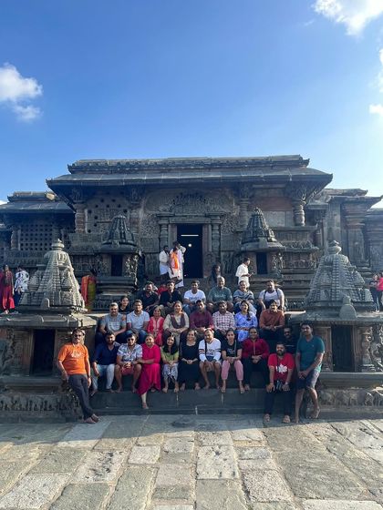 A group photo at the Belur temple, a UNESCO world heritage site. I ensure my tours cover the most significant historical locations in the region.