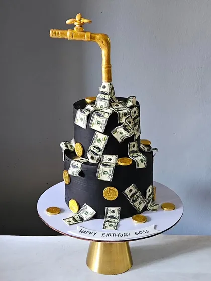 For the boss who deserves it all, I designed this gravity-defying money tap cake. This two-tier showstopper features a golden faucet appearing to pour a cascade of edible money, making it a fun and impressive cake for celebrating success.