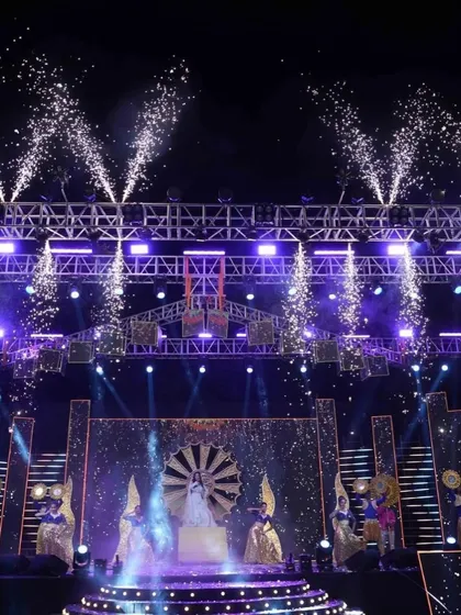 A bride's grand entry for her Sangeet performance, framed by cold pyrotechnics. I design every entry to be a showstopper.