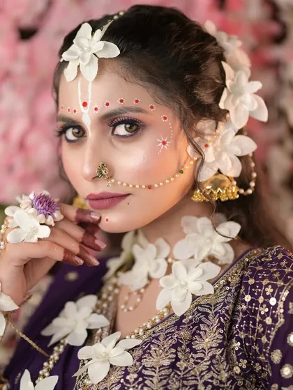 Makeup is an art form, and in my classes, we explore creativity. This is a close-up of a conceptual Radha look we created for Janmashtami, focusing on intricate details, soft makeup, and beautiful floral jewelry.
