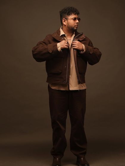 A full-body shot from a studio photoshoot. The corduroy fit has that vintage, old-school feel, which I often bring into my G-Funk tracks.
