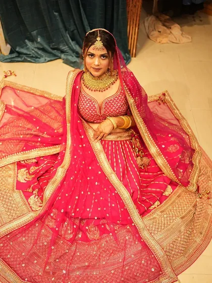 Explore our diverse collection of traditional red and pink bridal lehengas. Each piece, whether in rich velvet or silk, features unique embroidery and is designed to make your wedding day unforgettable.