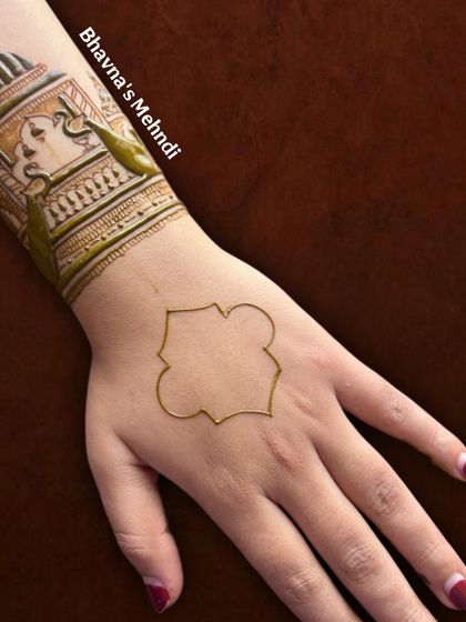 An outline of an elephant motif on the back of the hand. This is a great example of how we start our figure work.