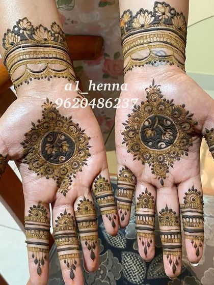 A stunning mandala design with intricate finger details and a matching wrist cuff.