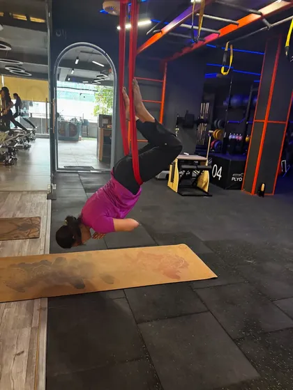 This inverted pose uses the hammock to support the hips, allowing for a deep, passive backbend and stretch through the shoulders. It is a fantastic way to improve flexibility with minimal strain.