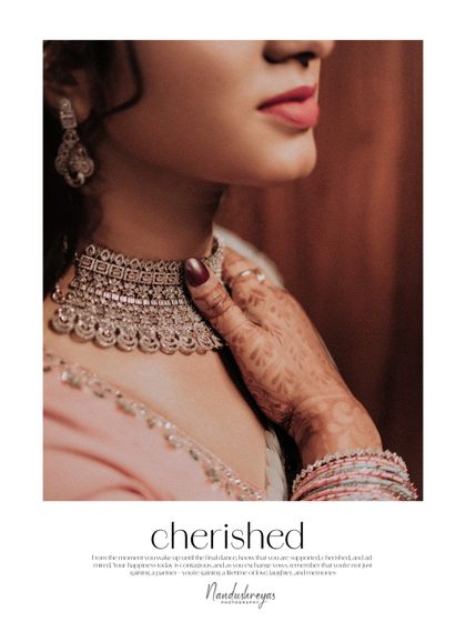 An artistic detail shot of the bride's necklace and henna-adorned hand. The word "cherished" perfectly describes the feeling of this elegant portrait.