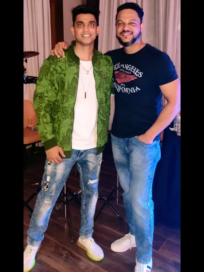 With my friend and talented percussionist, Paresh. We often perform together, creating a dynamic 'jugalbandi' of electronic beats and live percussion for birthdays and other events.