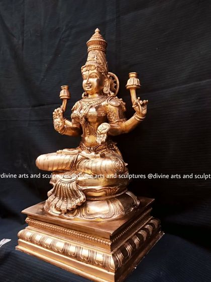 An 18-inch Panchaloha Lakshmi sculpture, created for the Shri Palimaru Mutt. The larger size allows for even more intricate detailing on her crown, jewelry, and throne.