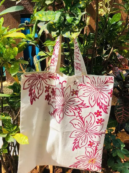 Here is a beautiful example of what you can create and take home from our block printing workshop. This tote bag, with its vibrant floral pattern, is ready to be used and shown off.