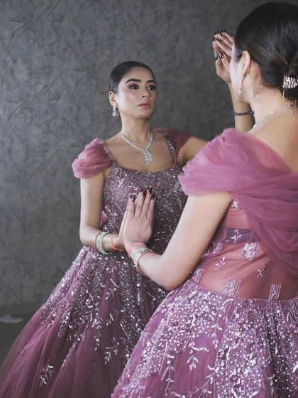 A creative shot with a mirror, reflecting the beauty and detail of this exquisite rental gown.