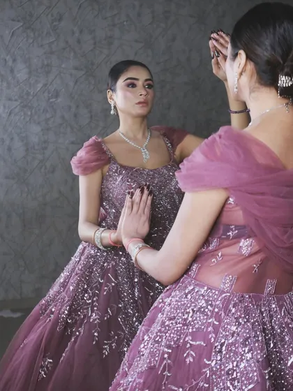 A creative shot showing the reflection of the gown, highlighting its beautiful silhouette and intricate details.