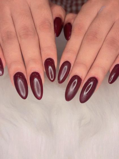 Cherry Mocha, a deep, rich reddish-brown, on perfectly shaped almond nails.