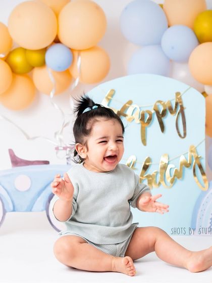The pure, uninhibited laughter of a one year old. This is the reward of a fun and playful photoshoot. My studio is a space where kids can be themselves, resulting in genuine expressions like this.