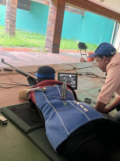 I am providing one-on-one guidance to a shooter during a 50M Prone practice session at the KSRA Shooting Range, preparing for the upcoming National Competition.