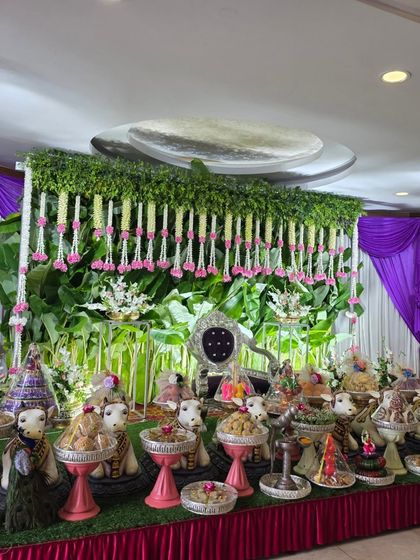 A side view of the stage with pink and green decor.