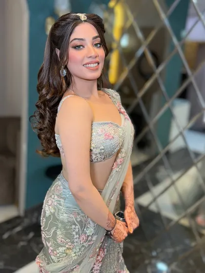This client is channeling her inner celebrity. The soft curls and ethereal makeup are a perfect combination for a glamorous event.