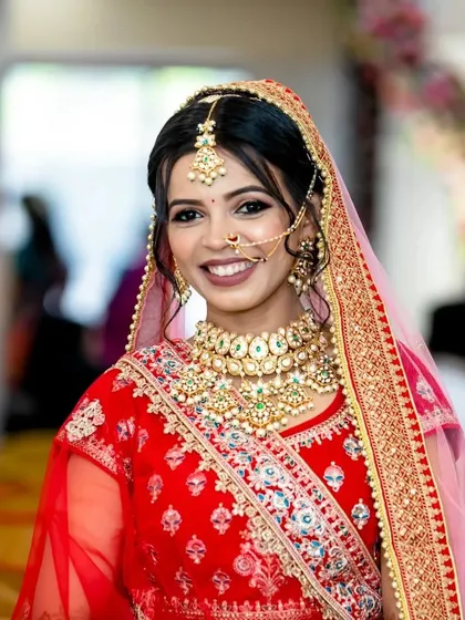 A beautiful portrait of a bride in her wedding attire. The intricate choker, maang tikka, and nath are all part of my customizable bridal rental collection.