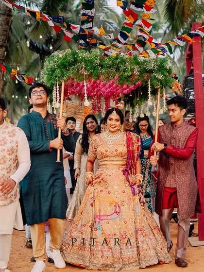 The bride's entrance, a journey through a tunnel of sacred Mauli threads and Tibetan prayer flags. This was a labor of love, taking 18 hours and 10 artisans to create a path of blessings.