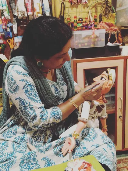 The final, most meditative step in bringing a puppet to life is painting the face. Each brushstroke adds character and soul. This is a quiet moment in my workshop where I am giving expression to a new wooden puppet, a process I am passionate about sharing with my students.