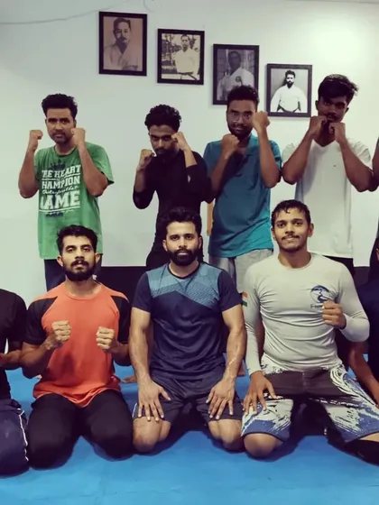 A group shot after a tough training session. We offer kids and adults MMA and BJJ classes, with free trial classes available for newcomers.