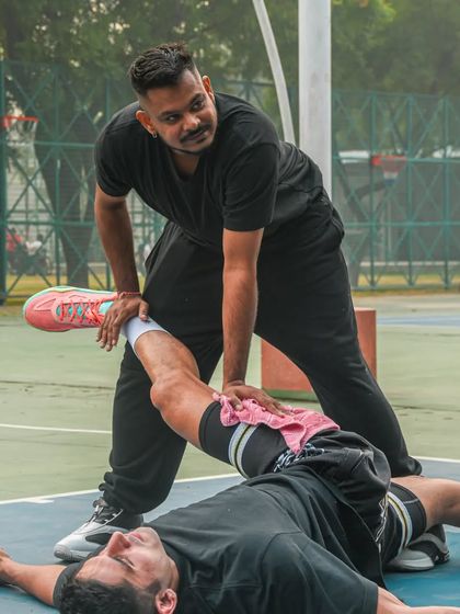 A dream takes sweat, determination, and hard work. Here I am helping a player with post workout stretching and recovery.