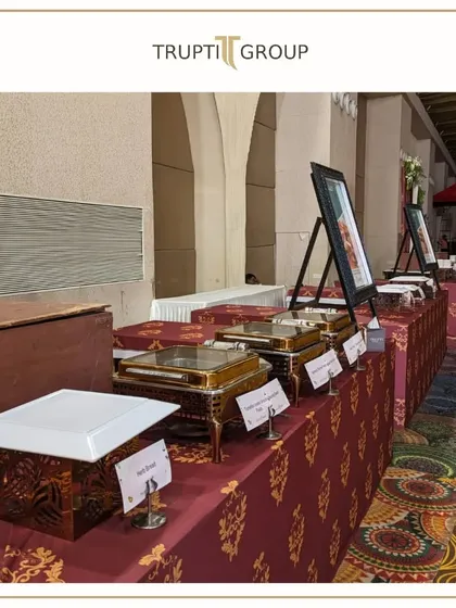 From setup hustle to pre event cheer. A look at our elegant buffet setup with traditional Indian block print linens and classic copper serving dishes.
