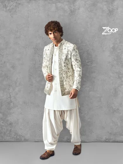 For a classic Sangeet or reception look, we crafted this embroidered jacket over a traditional kurta and Patiala salwar. It’s a timeless combination that offers both style and comfort for a night of celebration.