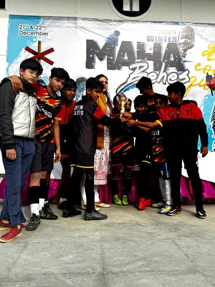 Our U-10 players receiving their championship trophy at the Junior Champions Cup. A proud moment for the team.