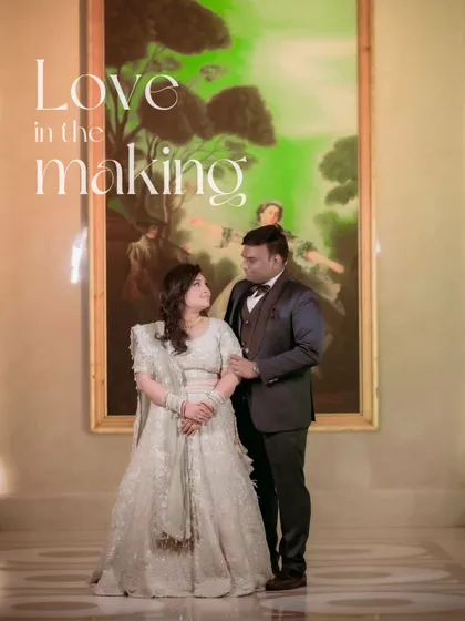 A beautiful portrait of Gagan and Shalini, framed by a large painting, giving the image an artistic and sophisticated feel.