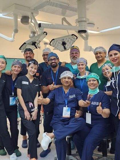 Thumbs up from the entire international faculty and organizing team after a successful live surgery workshop.