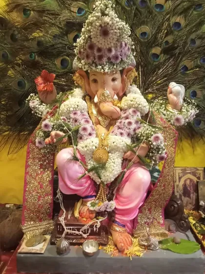 A close-up of our floral adornments for a beloved Ganpati Bappa. We design everything from the delicate garland to the intricate crown, using fresh flowers to bring divine beauty to your festival celebrations.