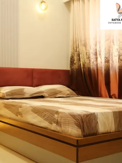 A bedroom with a warm and earthy color palette, featuring a rust-colored upholstered headboard and wooden bed frame for a cozy, grounded feel.