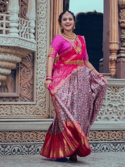 The flow of the lehenga skirt paired with our traditional gold-plated jewellery set, perfect for a vibrant wedding event.