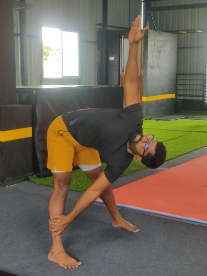 Stretching is a key part of every class. This triangle pose helps improve hamstring and side body flexibility.