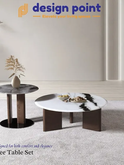 This coffee table set includes two separate tables of different heights and materials, one with a white marble top and the other with a dark marble top, allowing for versatile arrangements.