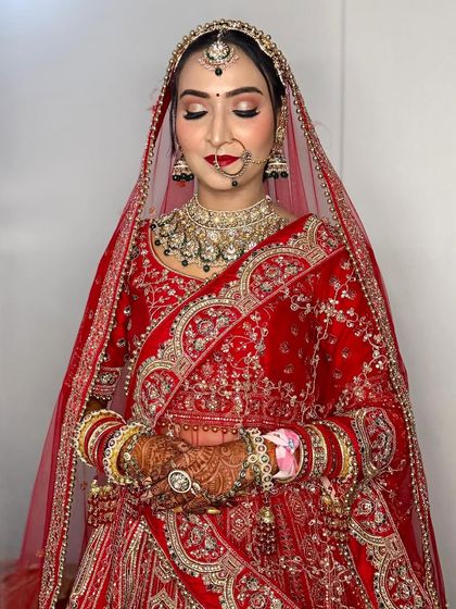 My bride Annu, looking so serene with her eyes closed. You can see the detail of her soft gold and pink eyeshadow.