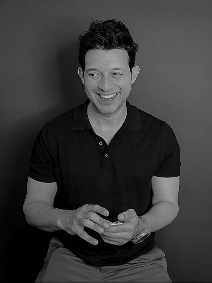 A candid, laughing moment from the second, more easy-going character. This shows a natural and unscripted side.