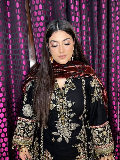 The complete look is a perfect fusion of traditional attire and modern, subtle glam makeup.