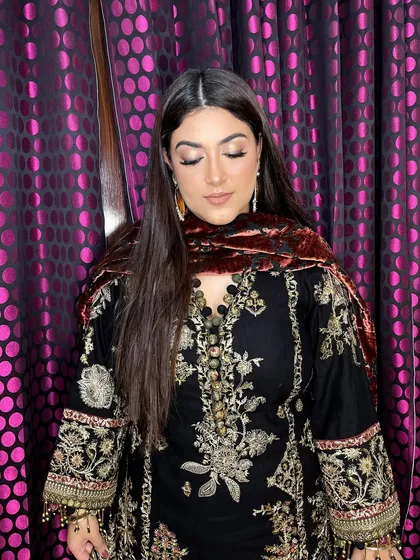 The complete look is a perfect fusion of traditional attire and modern, subtle glam makeup.