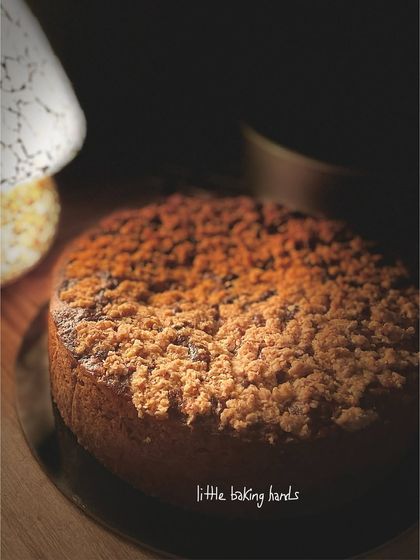 A side view of the banana-coconut-lime cake, showing off the thick, generous layer of streusel topping.