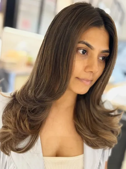 A lovely beige and caramel balayage blend. This color combination is perfect for adding warmth and dimension for a special occasion like a birthday.
