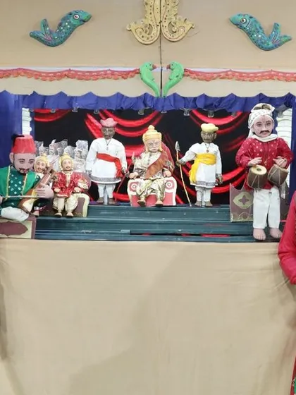 A traditional Indian string puppet (kathputli) performance on the Zee Marathi stage, showcasing a more classic style of puppetry.