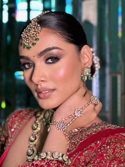 A detailed shot of the hathphool and the bride's soft makeup, capturing the essence of bridal beauty.