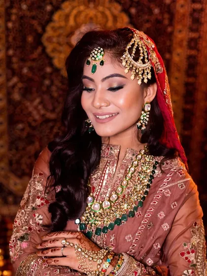 The beauty of a Walima bride. This image showcases a soft, glowing makeup look with defined eyes, perfect for the occasion.