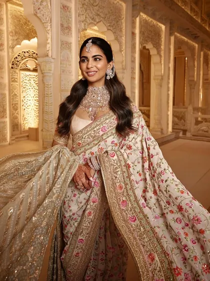 Another beautiful shot of the 'Garden of Love' look, highlighting the delicate floral patterns and the elegant drape of the saree. This is a great example of classic yet contemporary ethnic wear styling.