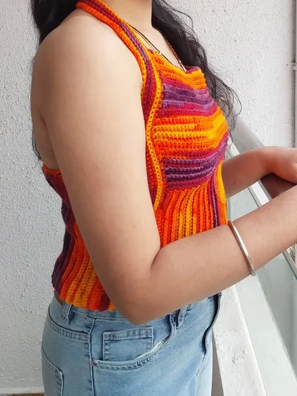 A side view of the Edith Top, showing how the vertical ribbing elongates the torso.