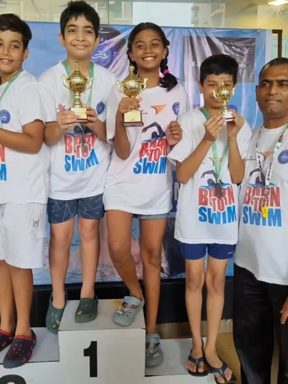 Our young champions on the podium after the Mumbai Swimming Challenge. Seeing them hold their trophies is the greatest reward for a coach. Their success is a direct result of their consistent effort in training.