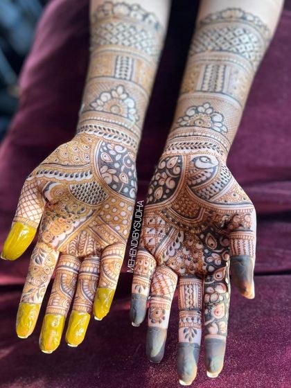 Another angle of this intricate bridal mehendi, showing the contrast between the fresh paste and the developing stain.